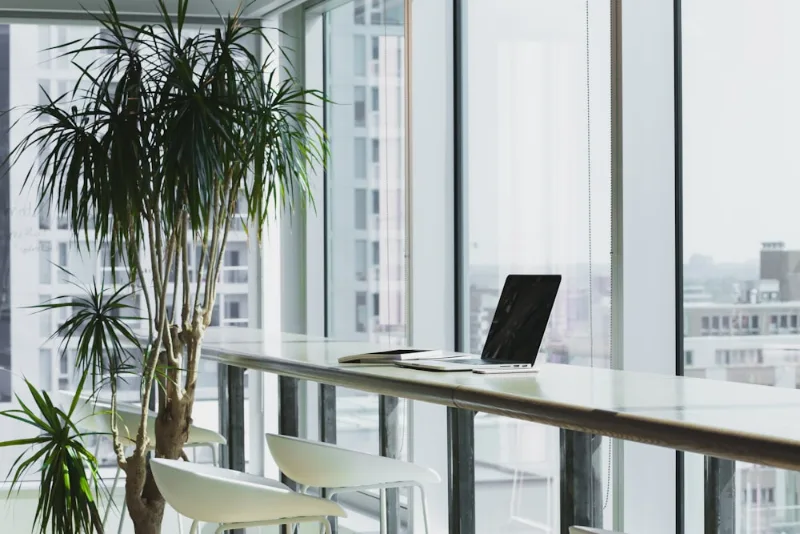 A clean professional workspace with computer keyboard and notebook for mindful work