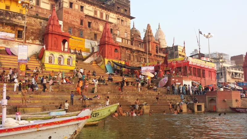 Peaceful morning mist and gentle golden sunlight over the sacred Ganga ghats in Varanasi