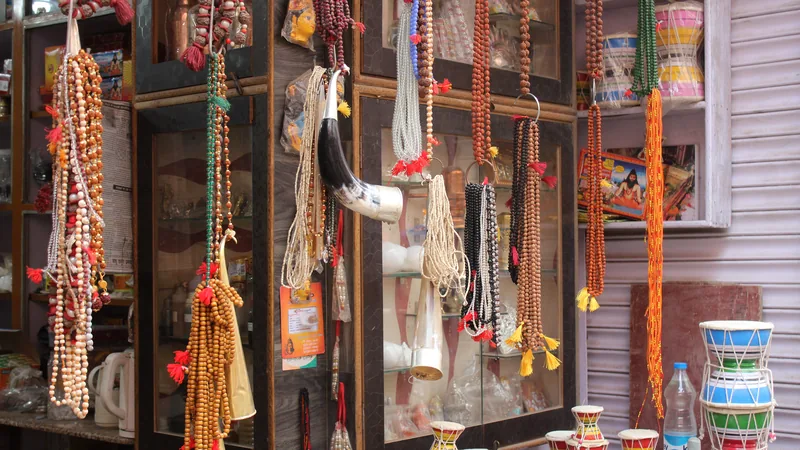 Authentic sacred Tulsi and Rudraksha Japa Mala beads resting on wooden steps in Varanasi